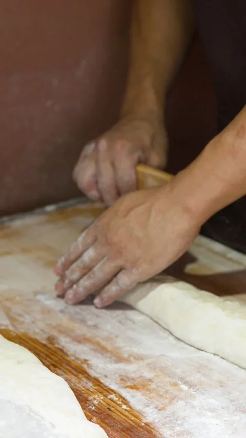 Asian Chef Cutting Bread Dough with Metal Bench Scraper 库存影片 340884080