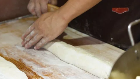 Asian Chef Kneading and Shaping Bread Dough with Bench Scraper 库存影片 340862539