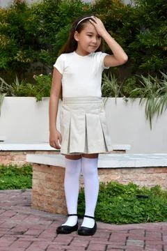 Asian Child Memory Problems Standing In Park Stock Photos