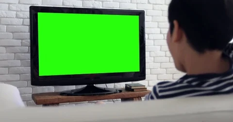 Asian child Play Computer Game Using with green screen on television. Stock Footage 82293958
