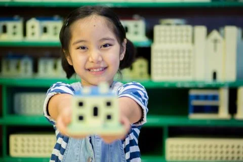 Asian Child playing construction model happily Stock Photos