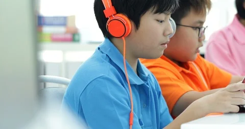 Asian child playing tablet computer together Stock Footage 89768985