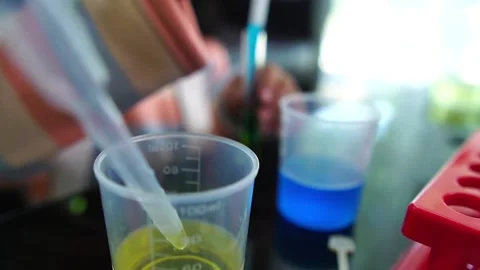 Asian children having fun doing liquid science lab experiments Stock Footage 221178970