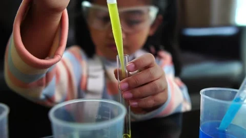 Asian children having fun doing liquid science lab experiments Stock Footage 221178971