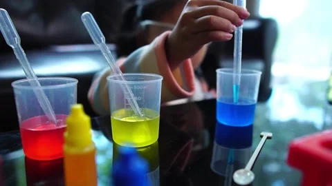 Asian children having fun doing liquid science lab experiments 動画素材 221180420