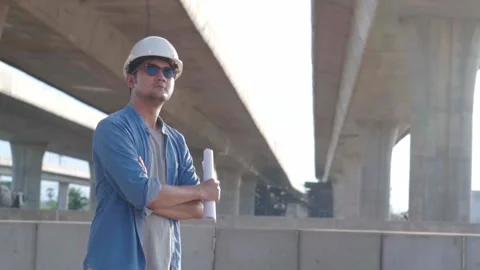 Asian civil engineer is inspecting construction project a road .expressway .. Video stock 244196289
