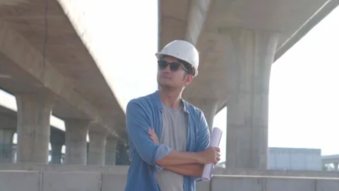 Asian civil engineer is inspecting construction project a road .expressway .. Video stock 244196290
