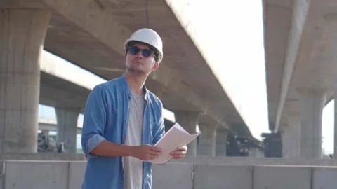 Asian civil engineer is inspecting construction project a road .expressway .. Stock Footage 244196292