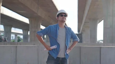 Asian civil engineer is inspecting construction project a road .expressway .. Video stock 244196294