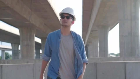 Asian civil engineer is inspecting construction project a road .expressway .. Stock Footage 244196352