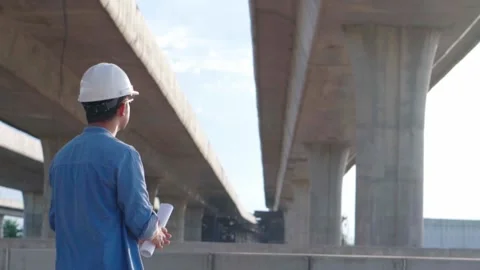 Asian civil engineer is inspecting construction project a road .expressway .. Video stock 244196459