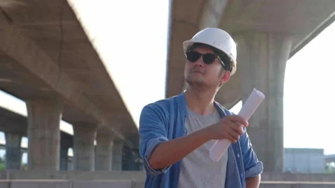 Asian civil engineer is inspecting construction project a road .expressway .. Stock-Footage 244196528
