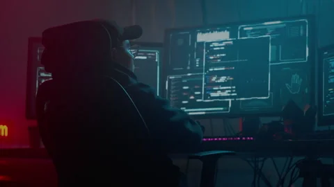 Asian coder focused on cyber attack at dark room with pc Stock Footage 257382942