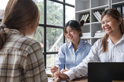 Asian College groups of students using laptop, tablet, studying together with Stock Photos