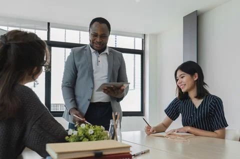 Asian college students' language classes study with foreign teachers. Stock Photos