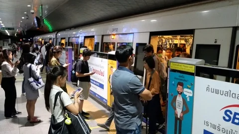 Asian commuters and city train Stock Footage 118660437