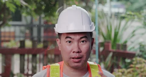 Asian construction worker engineer presents meeting with colleague video call Stock Footage 163533631