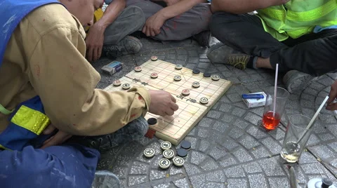 Asian construction workers play chess game in Ho Chi Minh City, Vietnam Video stock 61055862