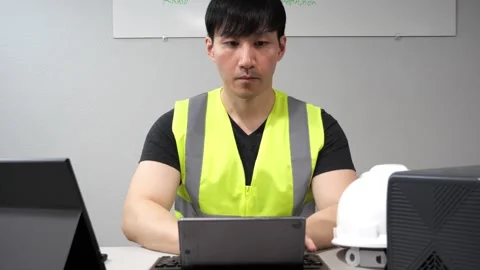 Asian constuction manager working with multiple devices Stock-Footage 263861719