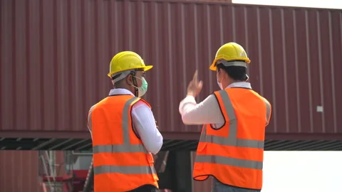 Asian container cargo warehouse worker wearing protective face mask using mob Stock Footage 154691470
