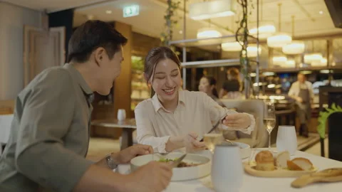 Asian couple having dinner at an upscale restaurant. 스톡 동영상 198907880