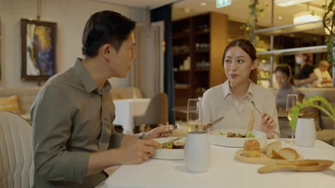 Asian couple having dinner at an upscale restaurant. Stock Footage 202215633