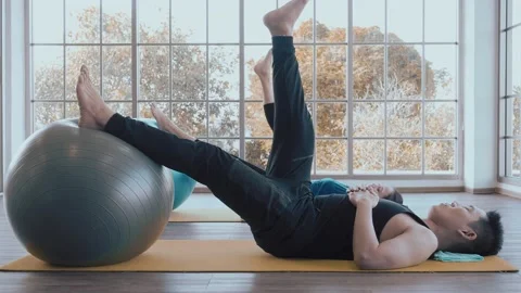 Asian couple lying on floor practice leg exercising togetherness concept. Stock Footage 147233076