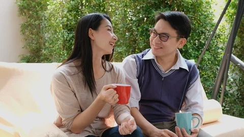 Asian couple talking and drinking coffee with happy and relaxing feeling Stock Footage 111663831