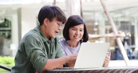 Asian couple two women using laptop and smartphone for online business working Stock Footage 163661218