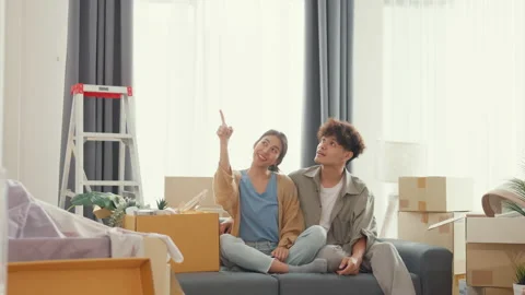Asian couple use design thinking pointing wall get idea decoration room. Stock Footage 232648290