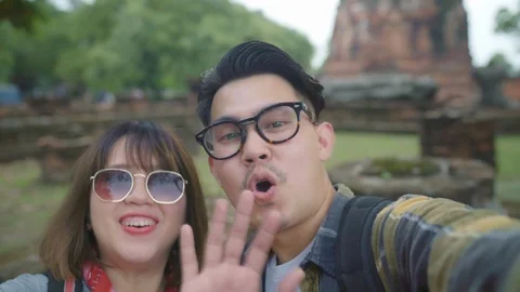 Asian couple using smartphone taking selfie holiday trip at Ayutthaya, Thailand. Stock Footage 102467631