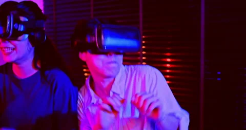 Asian couples wearing modern Virtual rea... | Stock Video | Pond5
