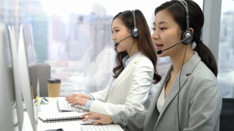 Asian customer service operator team working in the call center Stock Footage