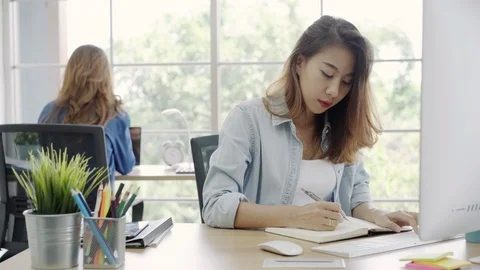 Asian Customer service women using computer answer customer e-mail on desk. Stock Footage