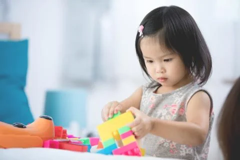 Asian cute child playing in the constructor block, Stock Photos
