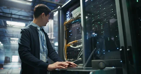 Asian Data Center Engineer Using Laptop Computer Video stock 319999798