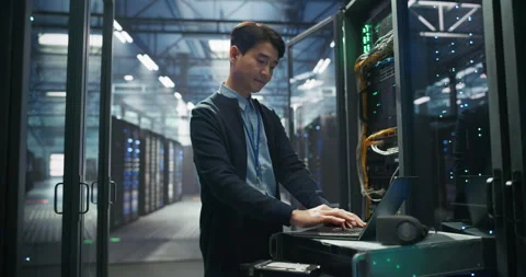 Asian Data Center Engineer Using Laptop Computer Video stock 319999856
