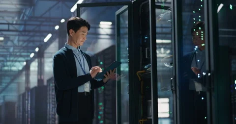 Asian Data Center Engineer Using Tablet Computer Stock Footage 320000679
