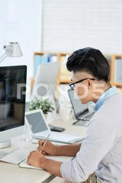 Asian designer sketching during work Stock Photos