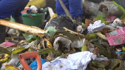 Asian dump. shovel rowing garbage. sorting. waste recycling. Stock Footage 127369190