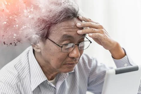 Asian elder lost memory from dementia or alzheimer disease concept Stock Photos
