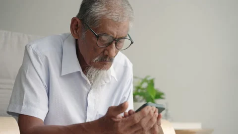 Asian elder man beard white using applications on smartphone. Stock Footage 201571182
