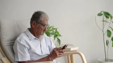 Asian elder man beard white using applications on smartphone. Stock Footage 201571202