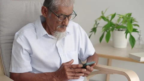 Asian elder man beard white using applications on smartphone. Stock Footage 201571279