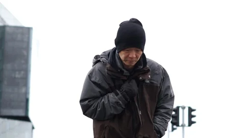 Asian elder man walking coldly outside in Iceland 스톡 동영상 128873091
