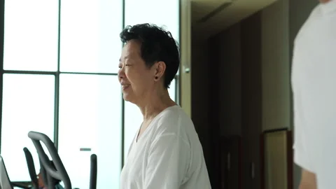 Asian elderly couple walking threadmill exercise in gym together healthy life Stock Footage 167315164