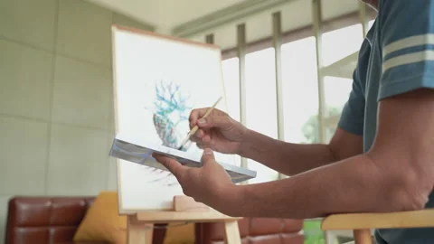 Asian elderly man drawing and painting on paper, hobbies of the elderly Stock-Footage 161053799