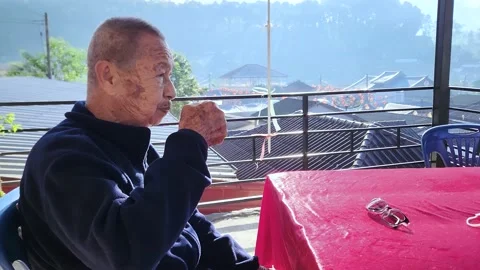 Asian elderly man  drinking tea relaxing alone at home. Aging Lifestyle concept. Stock Footage 228664673