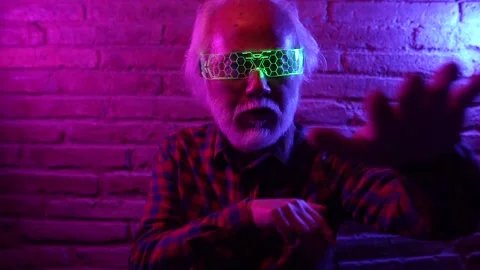 Asian elderly man, with virtual reality headset, doing futuristic martial art Stock Footage 195814954