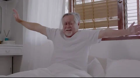 Asian Elderly man wake up and happy in bedroom. Stock Footage 152085046